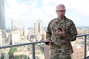 Man in military getting ready to video chat